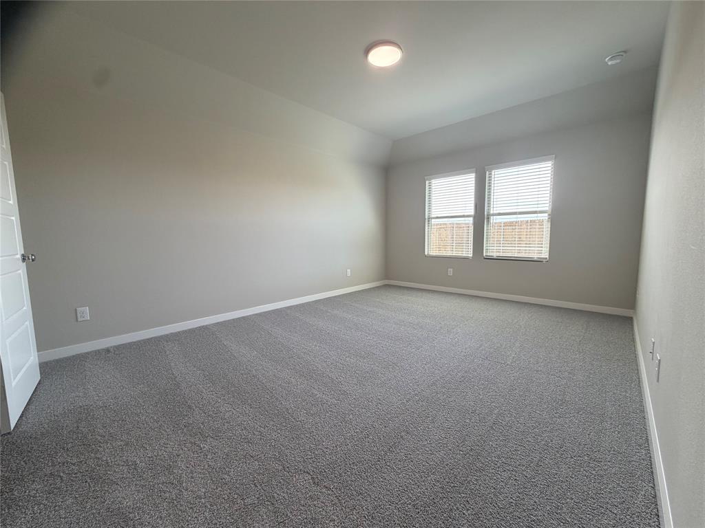 517 River Rdg Drive McKinney, TX 75071 - Photo 7 of 14 an empty room with a window