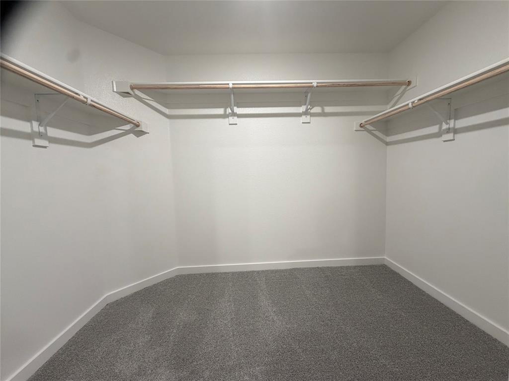 517 River Rdg Drive McKinney, TX 75071 - Photo 9 of 14 a view of a room with racks on the wall