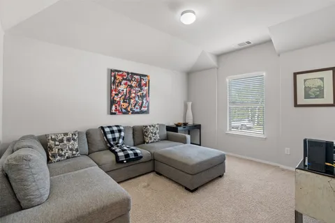 a living room with furniture and a couch