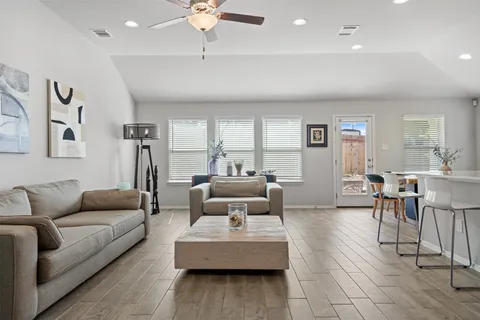 a living room with furniture and a large window