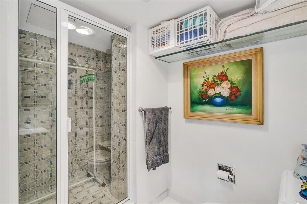 4280 Galt Ocean Drive, Unit 10A Fort Lauderdale, FL 33308 - Photo 23 of 36 a bathroom with a painting on the wall and shower