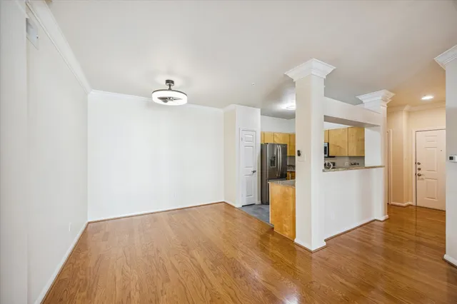 a view of a livingroom with wooden floor