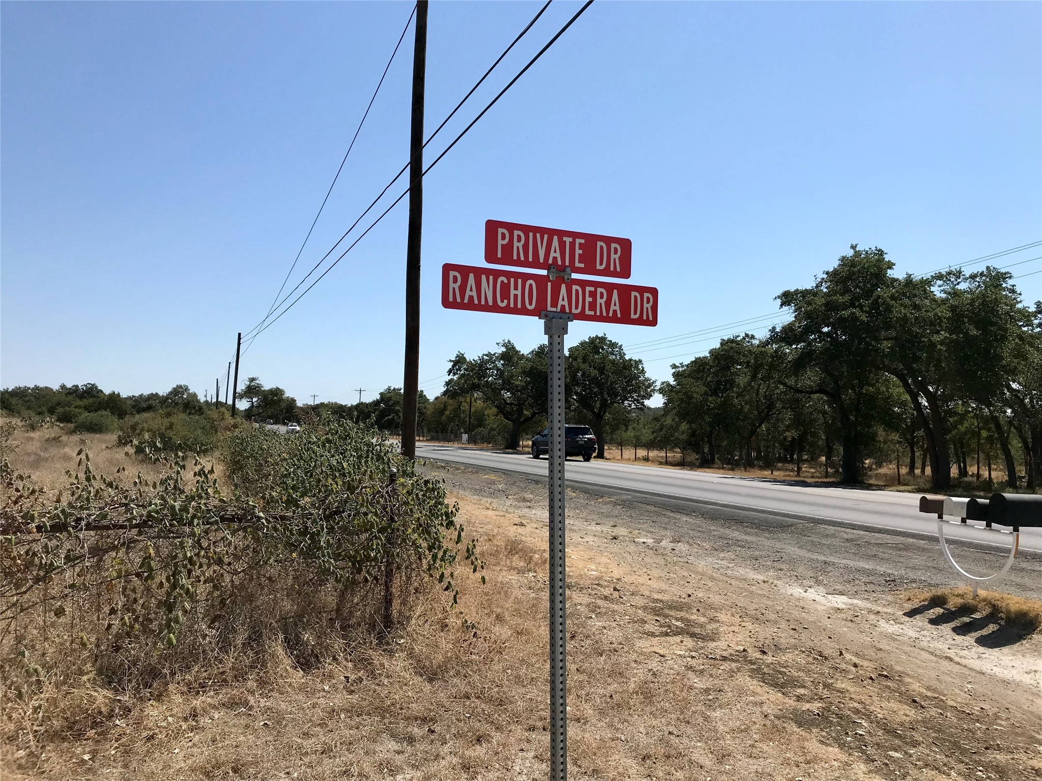 970 B Rr 32 San Marcos, TX 78666 - Photo 2 of 30 Sign at 32 when you will turn into the subdivision. The property runs from this sign to the east until the next driveway. Over 463’ frontage on 32.