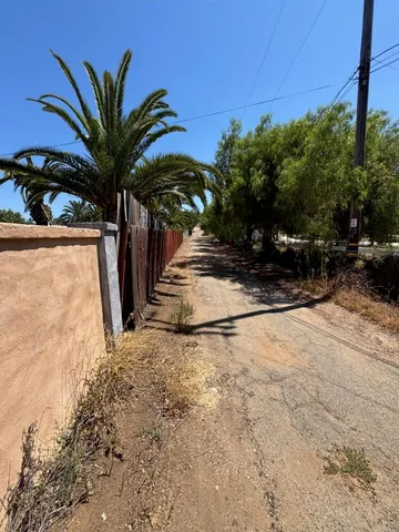a view of a backyard of the house