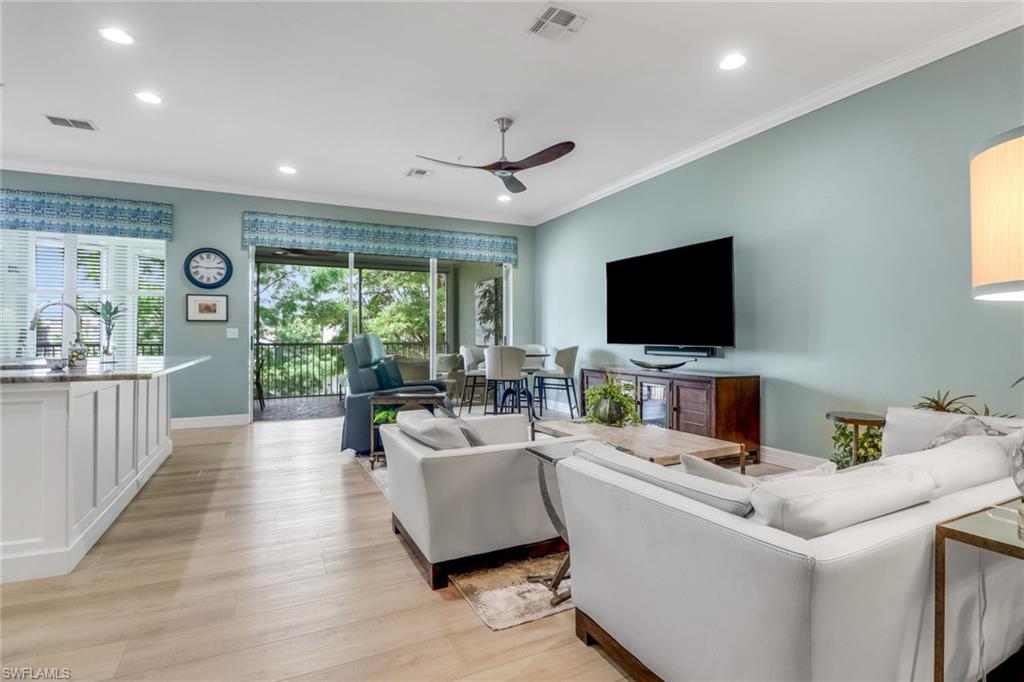 3530 Lansing Loop, Unit 204 Estero, FL 33928 - Photo 11 of 48 a living room with furniture and a flat screen tv