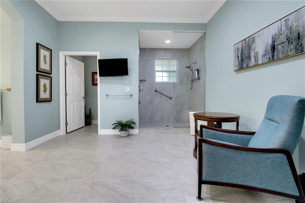 3530 Lansing Loop, Unit 204 Estero, FL 33928 - Photo 21 of 48 a view of an empty room with furniture and wooden floor
