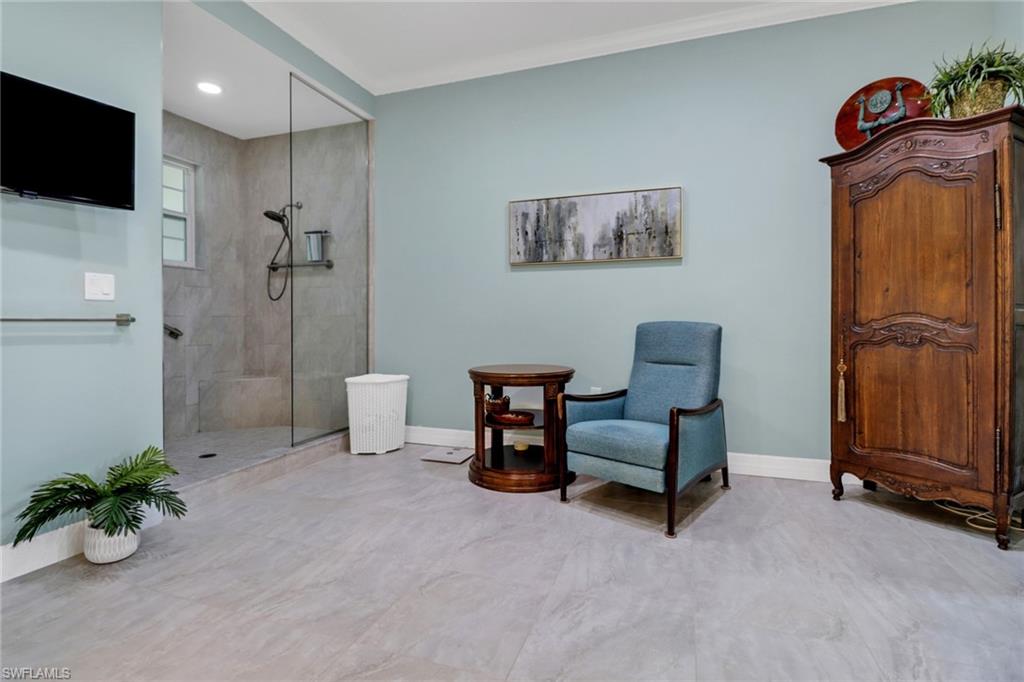 3530 Lansing Loop, Unit 204 Estero, FL 33928 - Photo 22 of 48 a living room with furniture and a flat screen tv