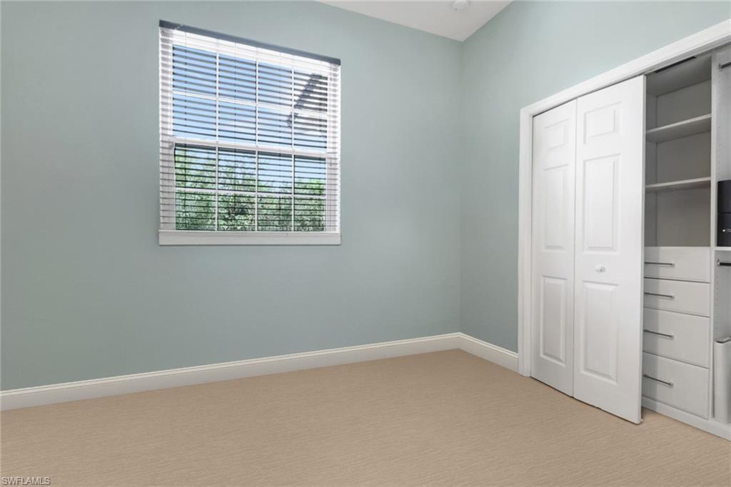3530 Lansing Loop, Unit 204 Estero, FL 33928 - Photo 28 of 48 an empty room with windows