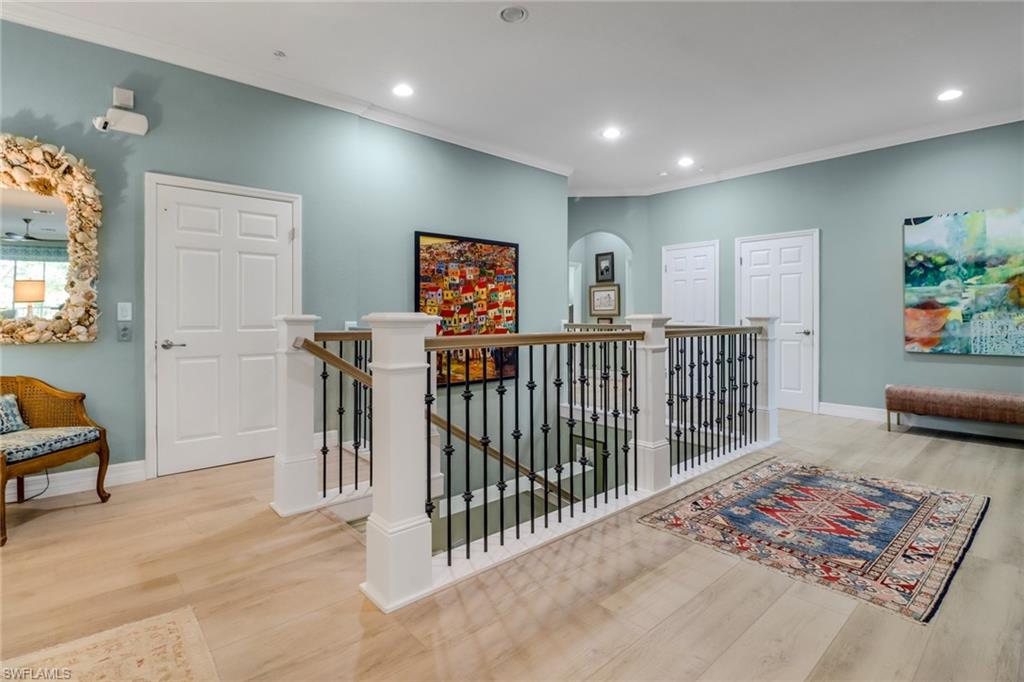 3530 Lansing Loop, Unit 204 Estero, FL 33928 - Photo 3 of 48 a view of a hallway with a livingroom and furniture