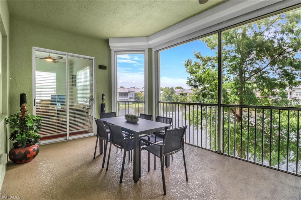 3530 Lansing Loop, Unit 204 Estero, FL 33928 - Photo 31 of 48 a dining room with furniture and garden view