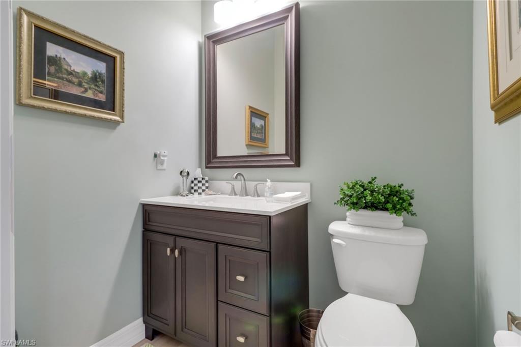 3530 Lansing Loop, Unit 204 Estero, FL 33928 - Photo 33 of 48 a bathroom with a toilet sink and mirror