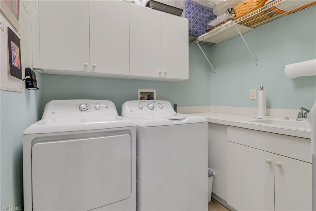 3530 Lansing Loop, Unit 204 Estero, FL 33928 - Photo 34 of 48 a utility room with dryer and washer
