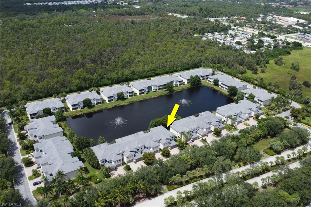 3530 Lansing Loop, Unit 204 Estero, FL 33928 - Photo 37 of 48 an aerial view of a house with a yard