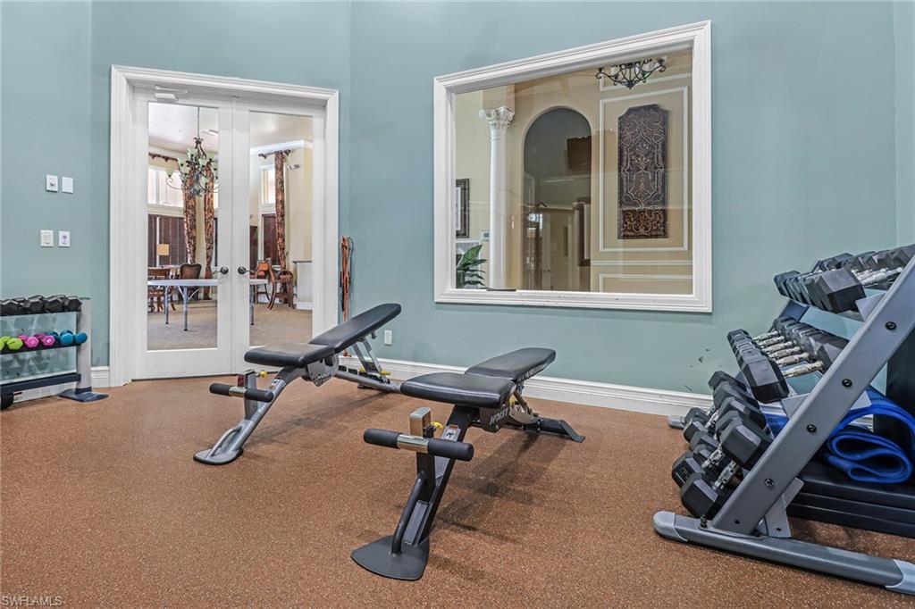 3530 Lansing Loop, Unit 204 Estero, FL 33928 - Photo 42 of 48 a view of a room with gym equipment
