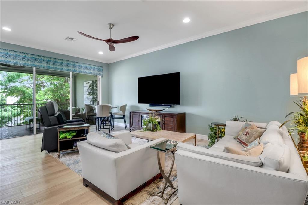 3530 Lansing Loop, Unit 204 Estero, FL 33928 - Photo 7 of 48 a living room with furniture and a flat screen tv