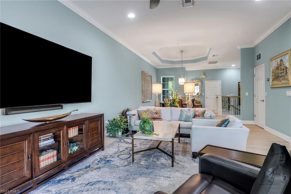3530 Lansing Loop, Unit 204 Estero, FL 33928 - Photo 8 of 48 a living room with furniture and a flat screen tv