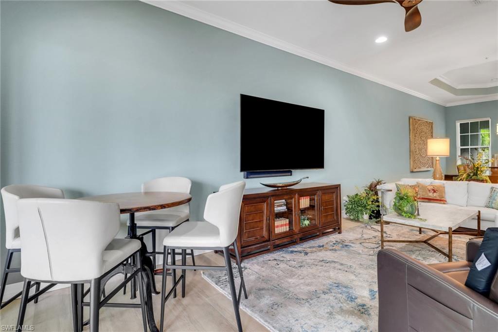 3530 Lansing Loop, Unit 204 Estero, FL 33928 - Photo 9 of 48 a living room with furniture and a flat screen tv