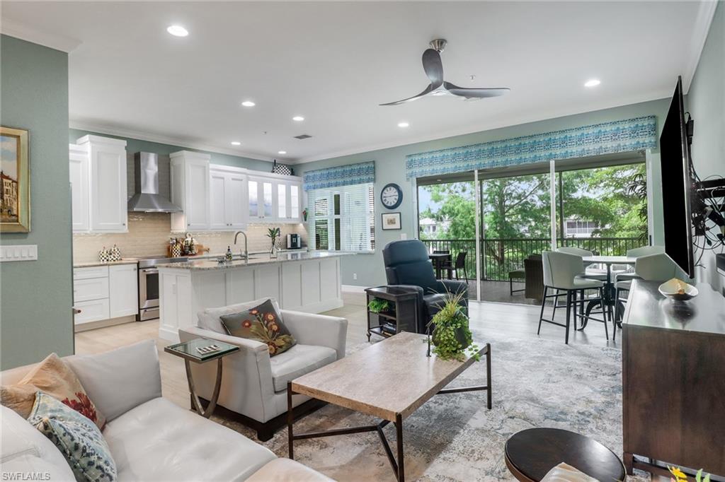 3530 Lansing Loop, Unit 204 Estero, FL 33928 - Photo 10 of 48 a living room with furniture and a large window