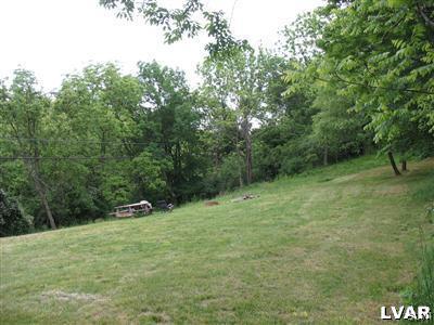 2423 Post Road Allentown, PA 18106 - Photo 2 of 3 a backyard of a house with trees