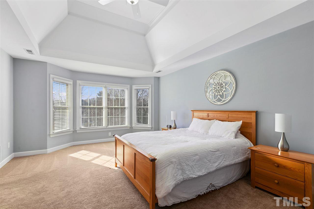 106 Ecklin Lane Cary, NC 27519 - Photo 14 of 29 a bedroom with a bed and a window