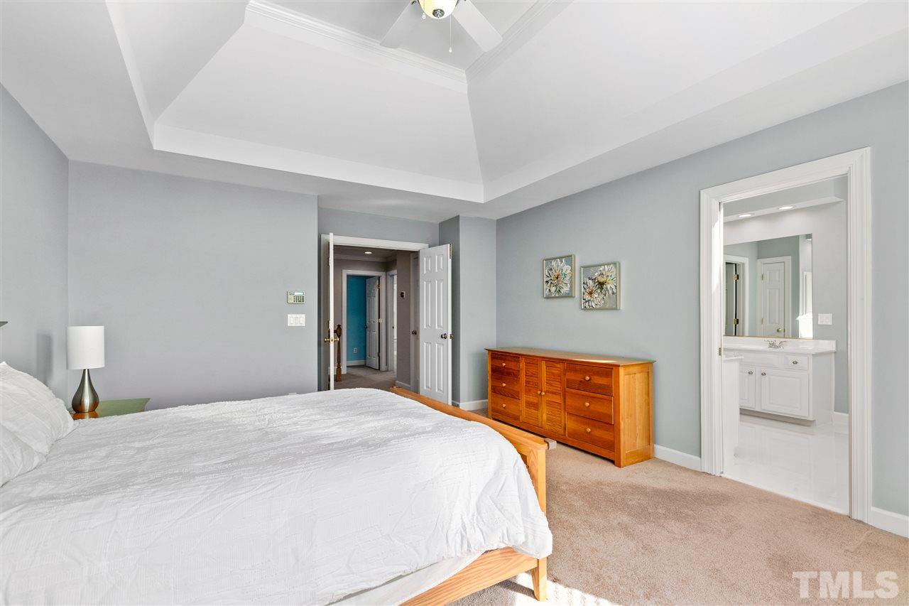 106 Ecklin Lane Cary, NC 27519 - Photo 15 of 29 a bedroom with bed and wall painting