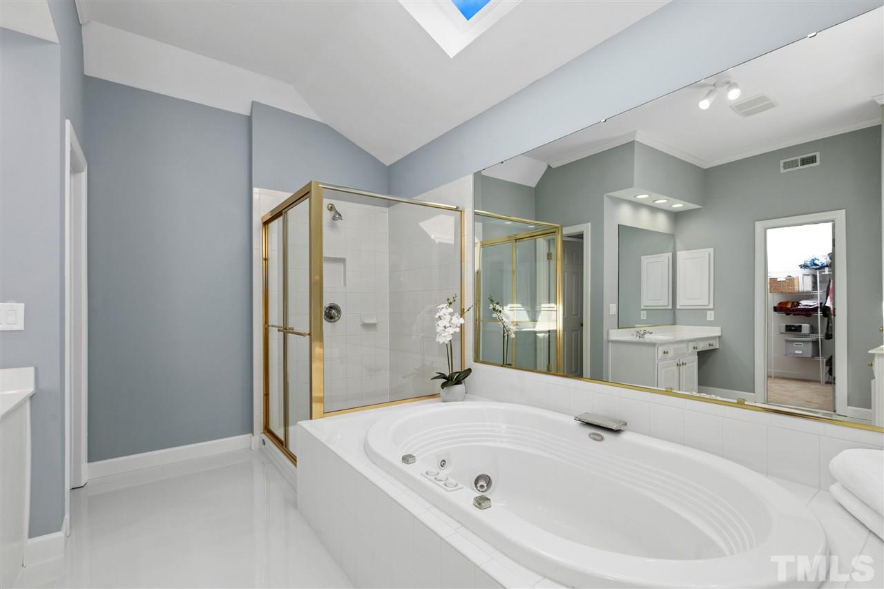 106 Ecklin Lane Cary, NC 27519 - Photo 16 of 29 a bathroom with a bathtub and a shower