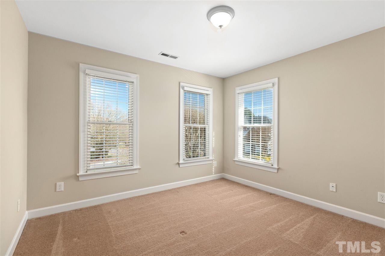 106 Ecklin Lane Cary, NC 27519 - Photo 19 of 29 an empty room with windows