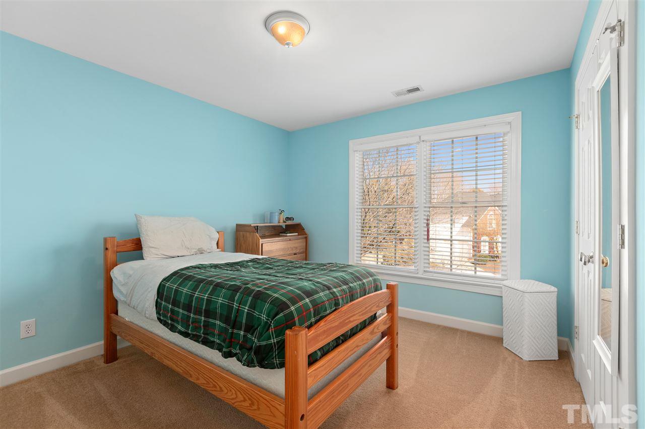 106 Ecklin Lane Cary, NC 27519 - Photo 20 of 29 a bedroom with a bed and a window