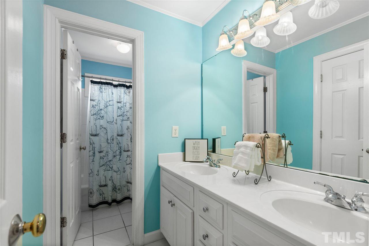 106 Ecklin Lane Cary, NC 27519 - Photo 21 of 29 a bathroom with a double vanity sink mirror and shower