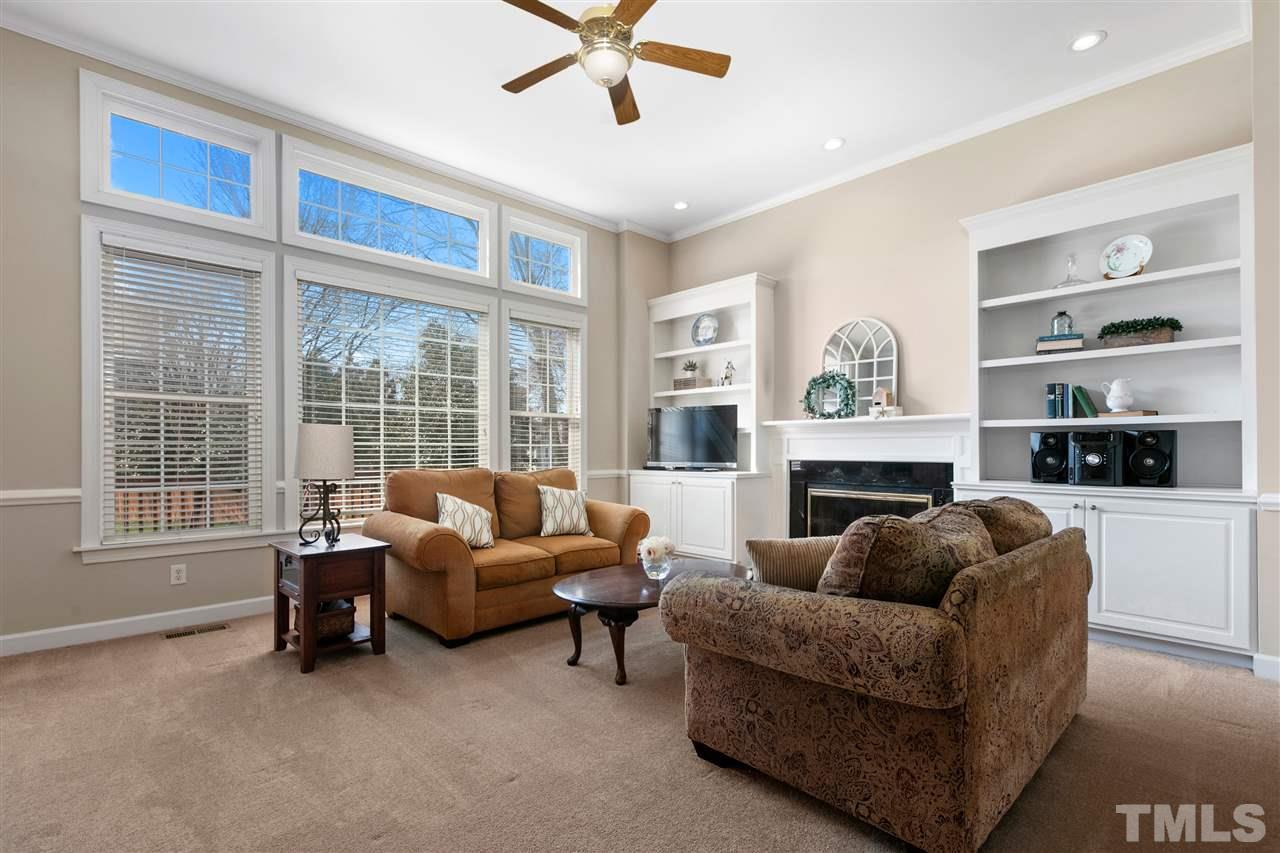 106 Ecklin Lane Cary, NC 27519 - Photo 5 of 29 a living room with furniture and a fireplace