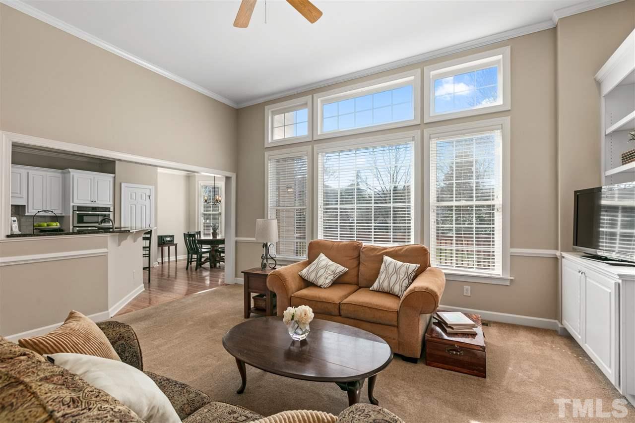 106 Ecklin Lane Cary, NC 27519 - Photo 7 of 29 a living room with furniture and a flat screen tv
