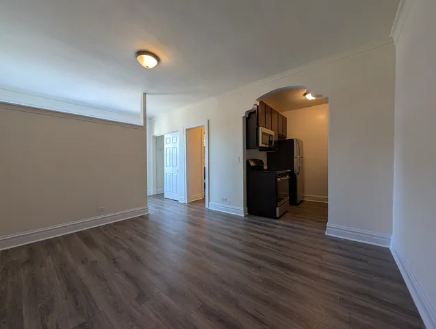 a view of a livingroom with wooden floor