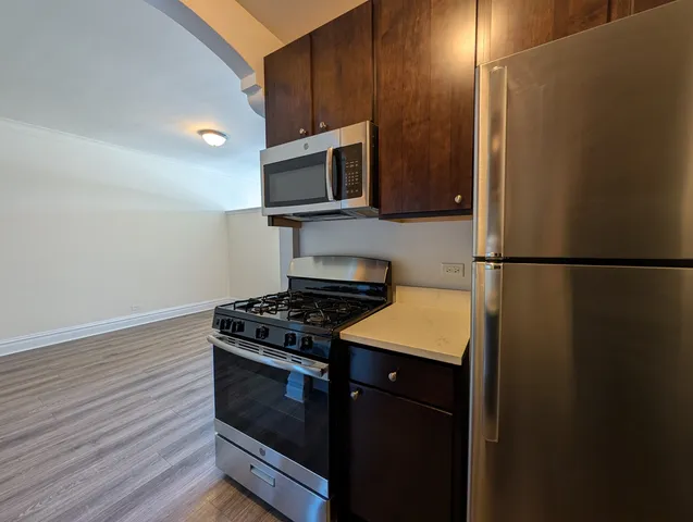 a kitchen with a stove and a microwave