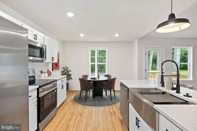 a kitchen with a sink stove and refrigerator