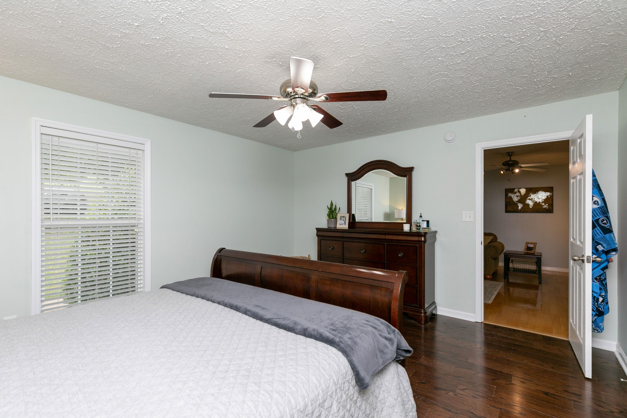 19 B Vantrease Road Brush Creek, TN 38547 - Photo 17 of 41 a bedroom with a bed and a chandelier
