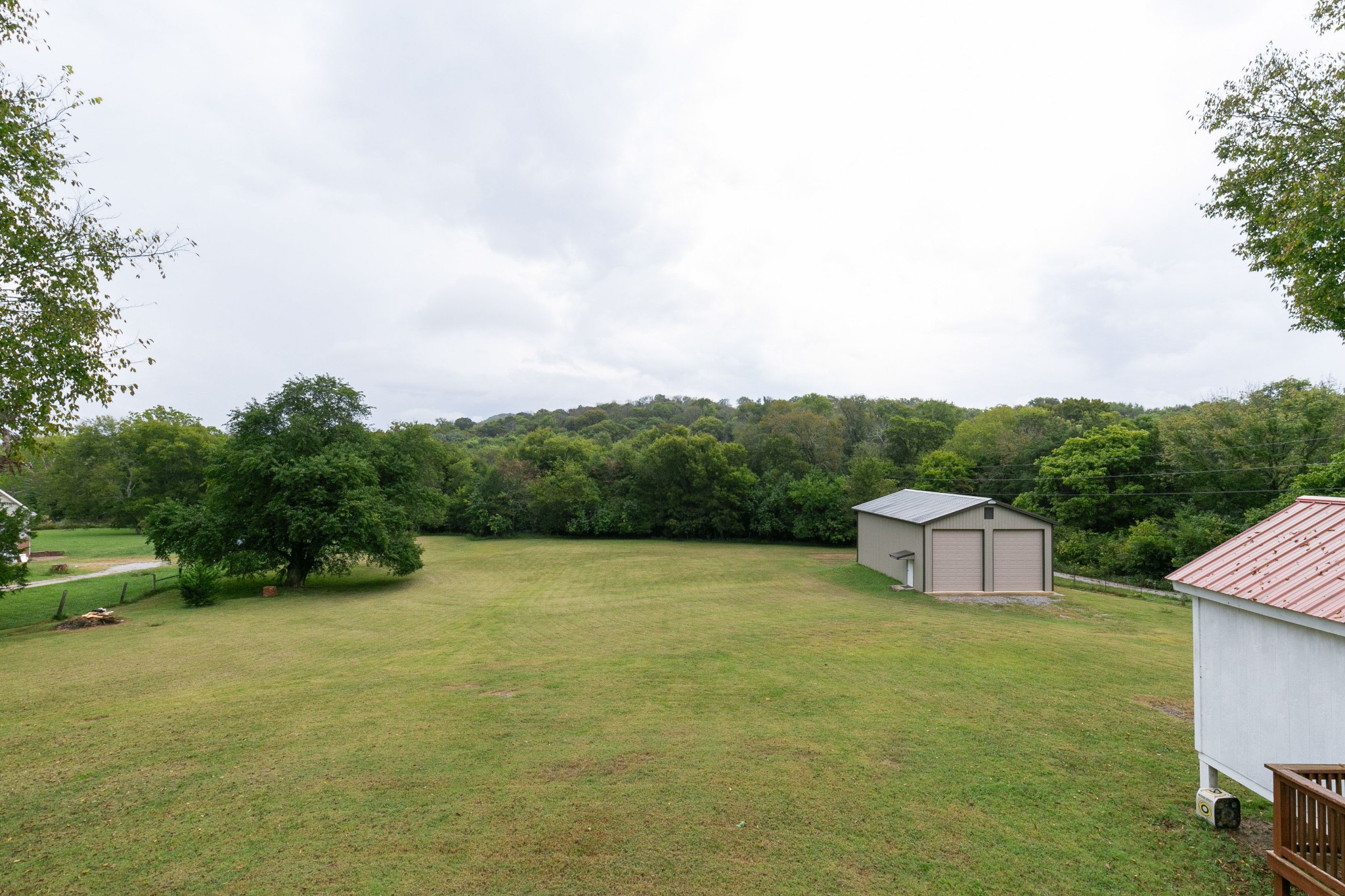 19 B Vantrease Road Brush Creek, TN 38547 - Photo 34 of 41 a view of a field with an trees