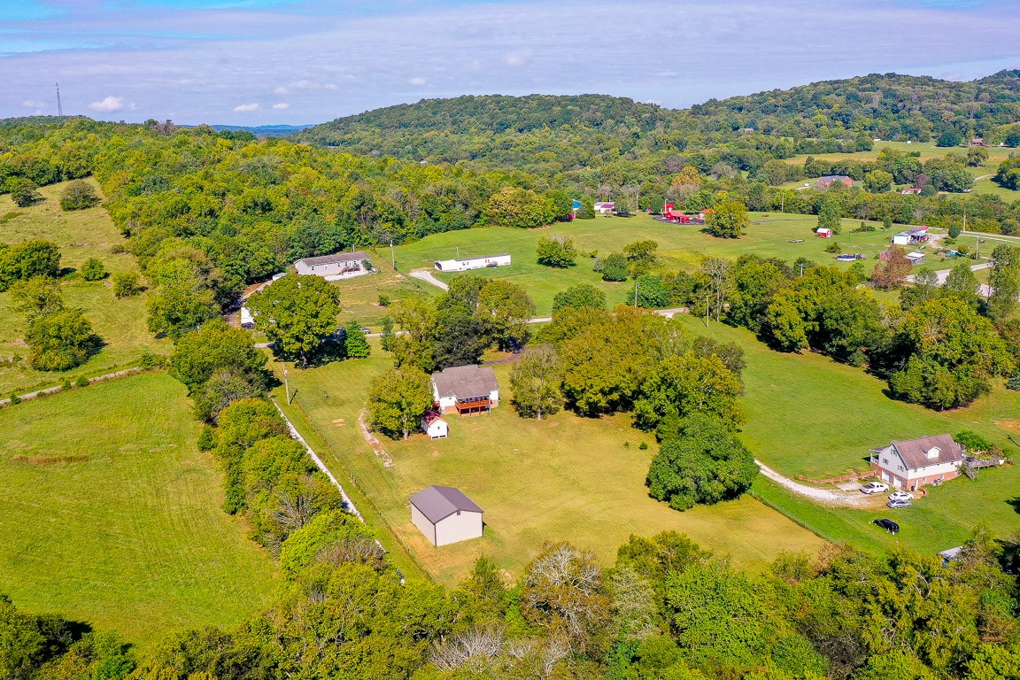 19 B Vantrease Road Brush Creek, TN 38547 - Photo 41 of 41 a view of a houses with a lush green hillside