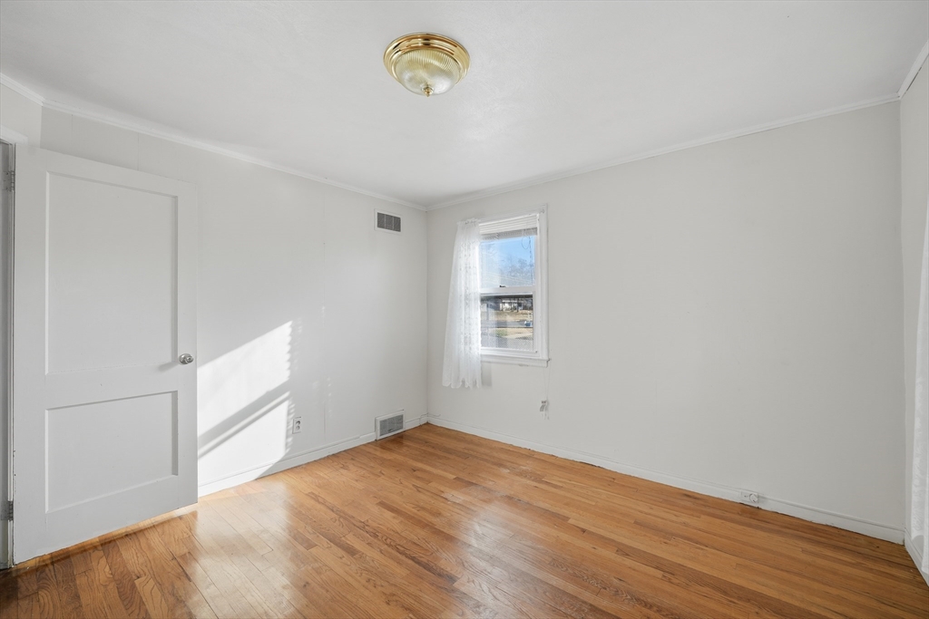 744 Bradley Road Springfield, MA 01109 - Photo 18 of 24 a view of empty room with wooden floor