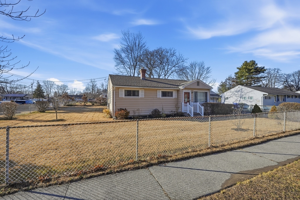 744 Bradley Road Springfield, MA 01109 - Photo 7 of 24 a view of a house with backyard and trees