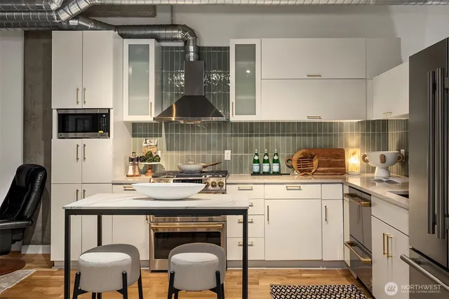 a kitchen with a sink cabinets and dining table