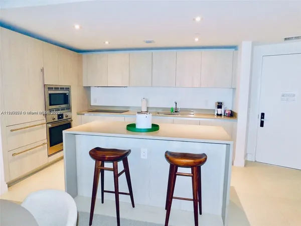 a bedroom with a bed and a lamp