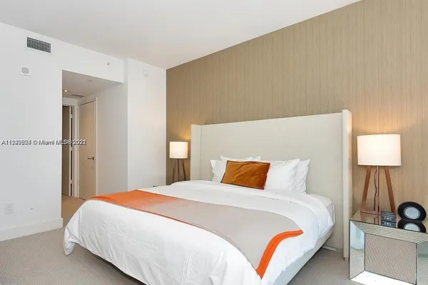 a bathroom with a toilet a sink and a mirror