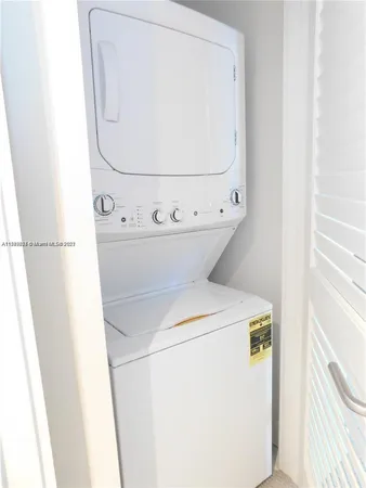 a bathroom with a walk in closet and a window