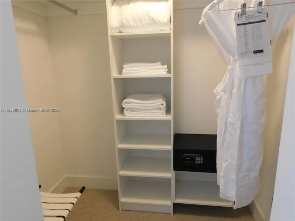 a living room with a flat screen tv and a window