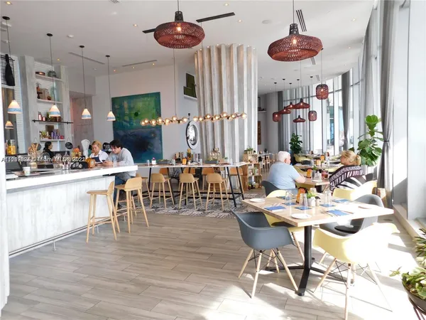 a view of hall way with furniture