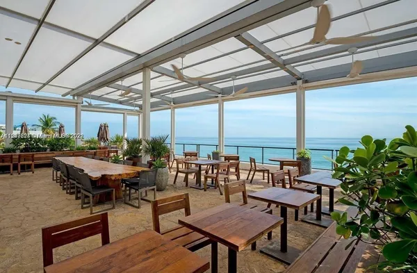 a outdoor space with lots of furniture and a potted plant