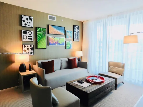 a living room with furniture and a table