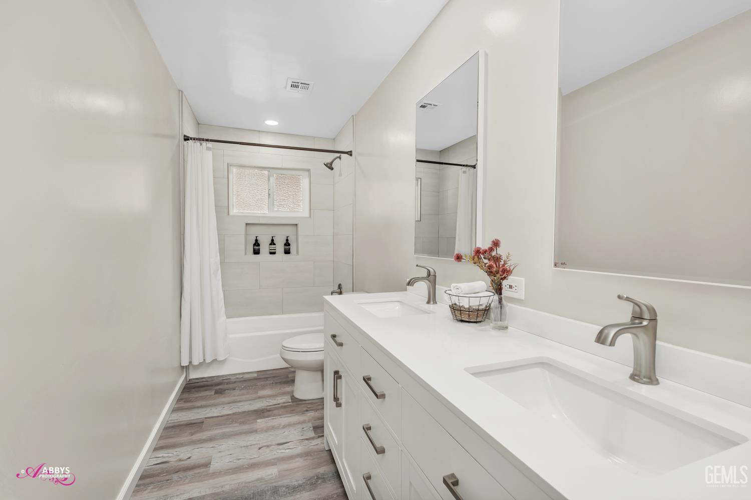 Undisclosed Address Bakersfield, CA 93309 - Photo 12 of 22 a bathroom with a sink a toilet and shower