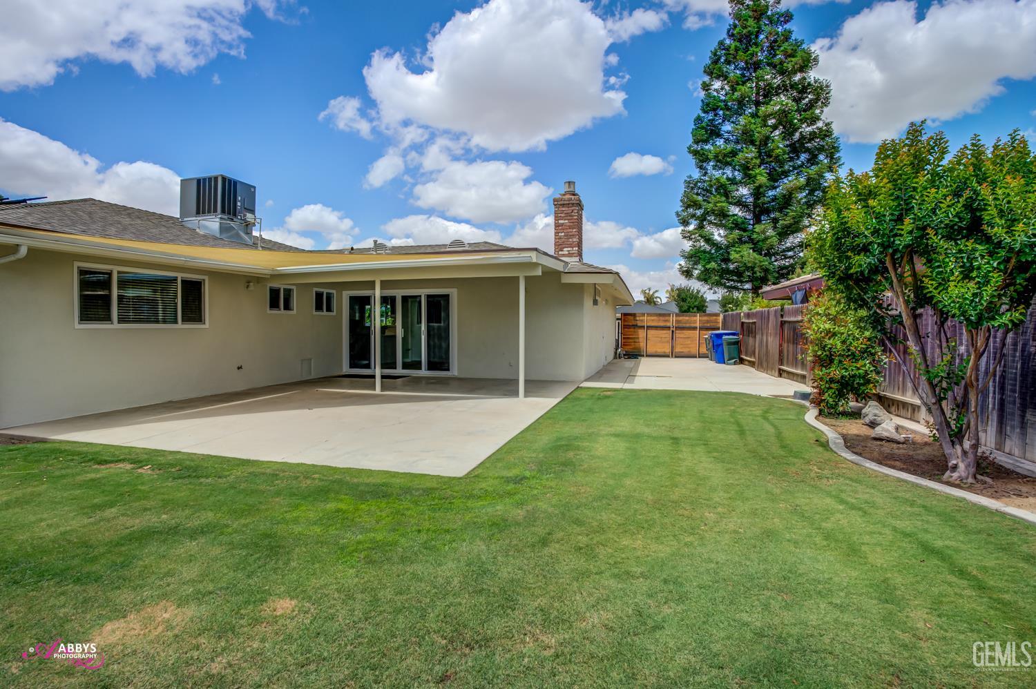 Undisclosed Address Bakersfield, CA 93309 - Photo 19 of 22 a view of an house with backyard space and garden