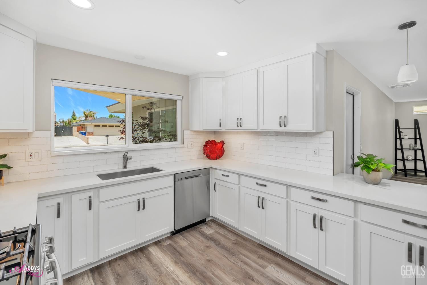 Undisclosed Address Bakersfield, CA 93309 - Photo 3 of 22 a kitchen with white cabinets and a window
